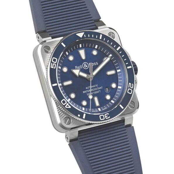 Close-up of the BR 03 Diver’s blue rubber strap with a ribbed texture, secured by a polished steel pin buckle, designed for durability and comfort in underwater conditions.