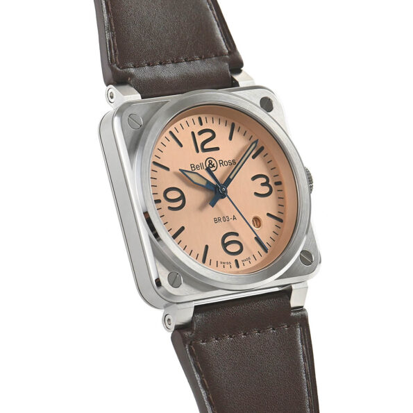 Right side angle of the Bell & Ross BR 03 Copper watch highlighting its brushed copper PVD finish, fixed bezel design, and the seamless transition from case to the stitched brown leather strap with a polished steel buckle.